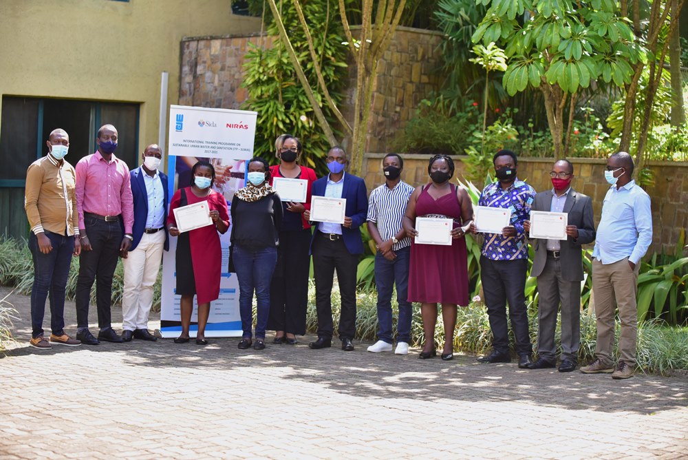 Trainees in a group photo after receiving certificates. 