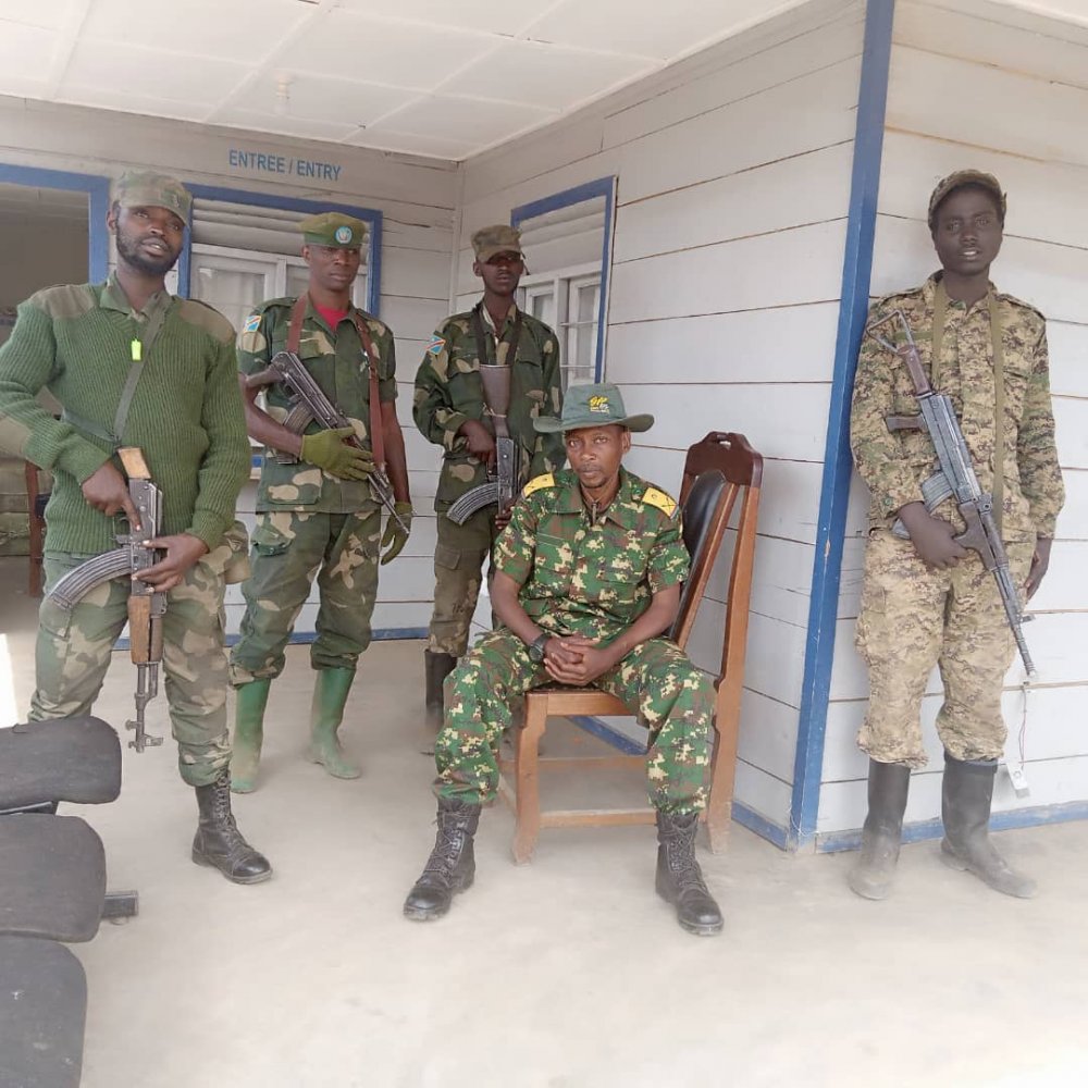 Maj Willy Ngoma surrounded by his men. 