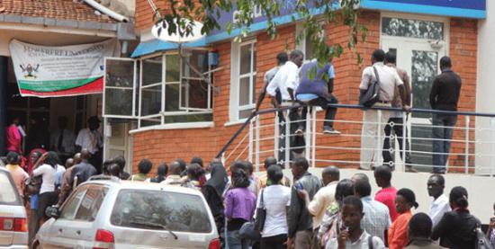 Makerere University students line up to pay tuition fees at the campus.