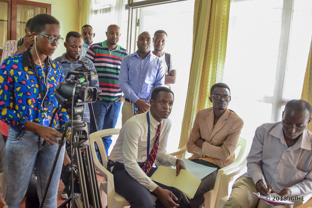 Members of the media in a press conference