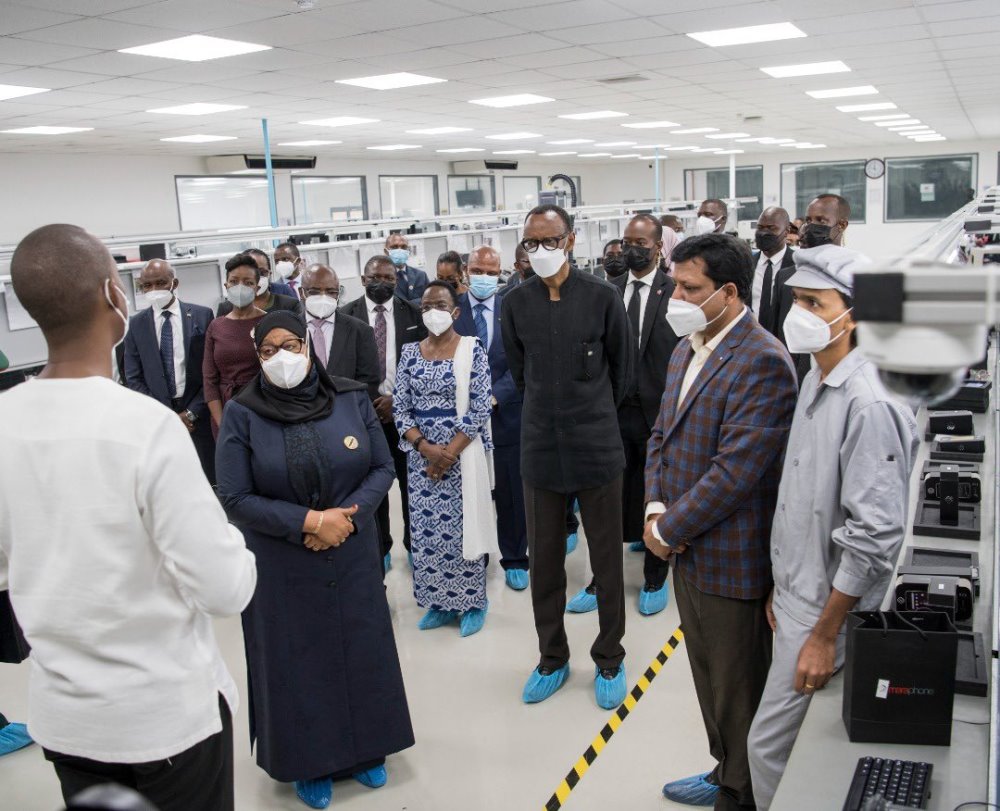 President Paul Kagame and Samia Suluhu Hassan receiving explanations as they visited Mara Phones manufacturing plant.