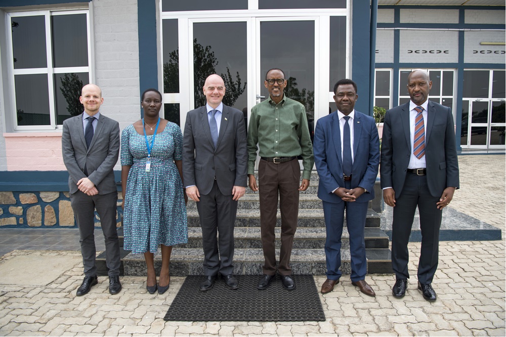 President Paul Kagame and  Gianni Infantino pose for a group photo.