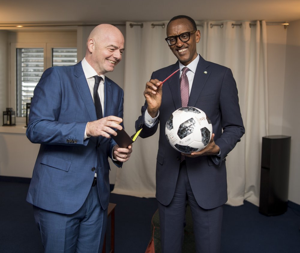 Kagame receiving a football present from the President of the International Football Federation Association (FIFA) Gianni Infantino whom they met on January 26, 2018 at the World Economic Forum in Davos