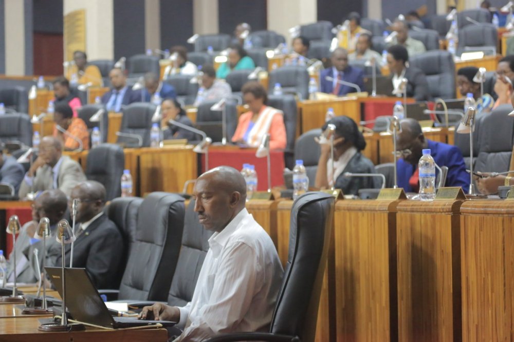 Members of the parliament follow proceedings