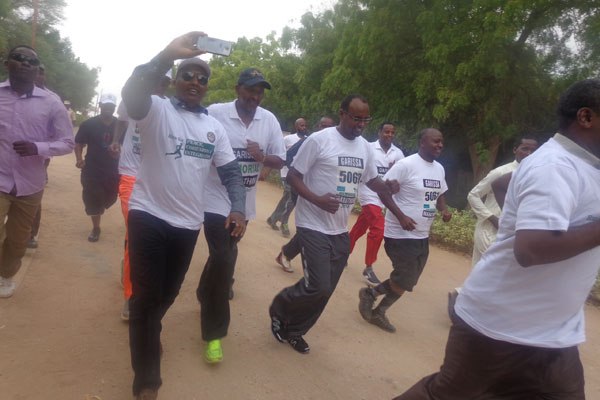Majority Leader in the National Assembly and Garissa Township MP Aden Duale (in black cap) and other local leaders participate in a marathon to mark one year since the Garissa University College terror attack that left 148 dead.