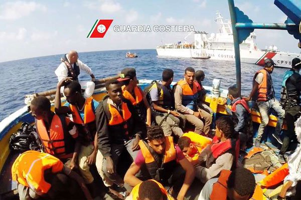 Migrants on a boat in the Mediterranean Sea during a rescue operation by the Italian coastguard, August 29, 2016.