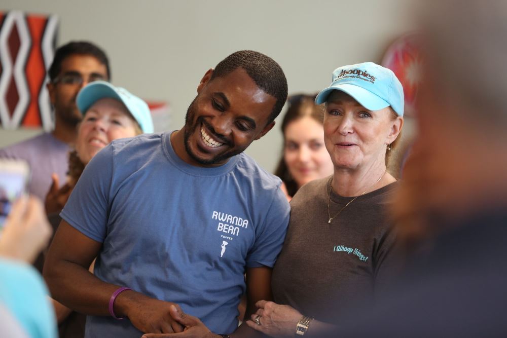 Mike Mwenedata, the founder and owner of Rwanda Bean Coffee with Linda Cohen, the Mayor of the City of South Portland