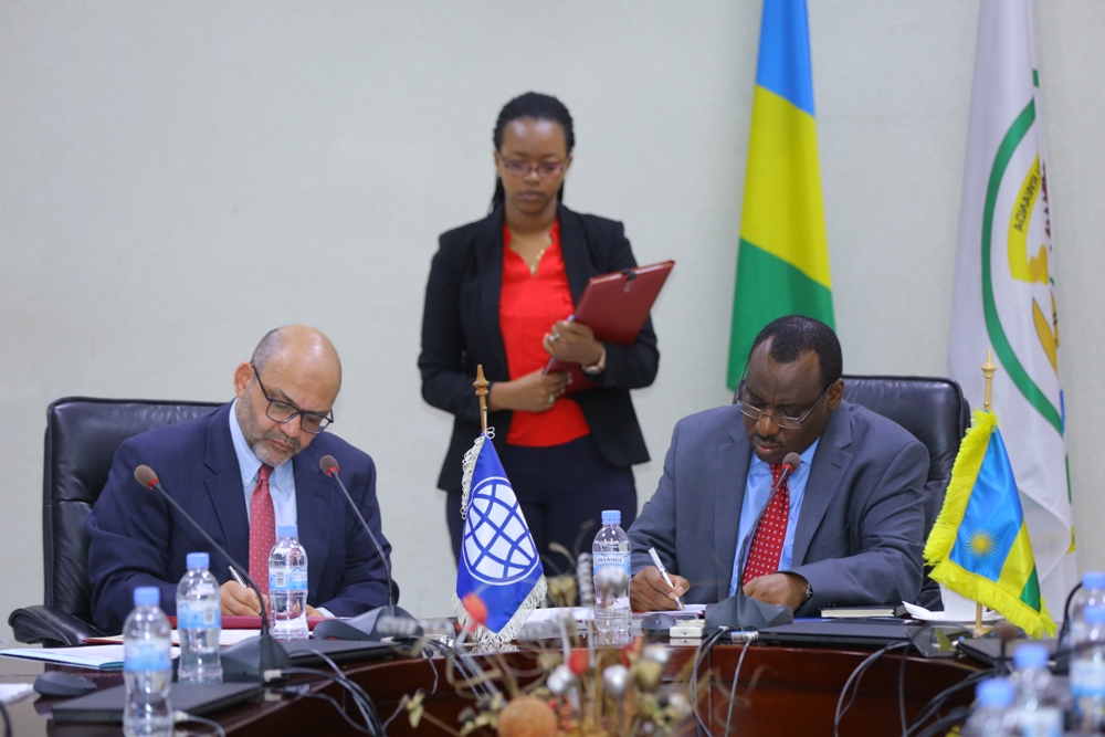 Minister of Finance and Economic Development, Claver Gatete (R) and the World Bank Country Manager Yasser El-Gammal.