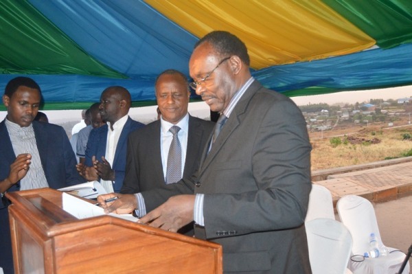 The Minister of Trade and Industry, François Kanimba signing agreements