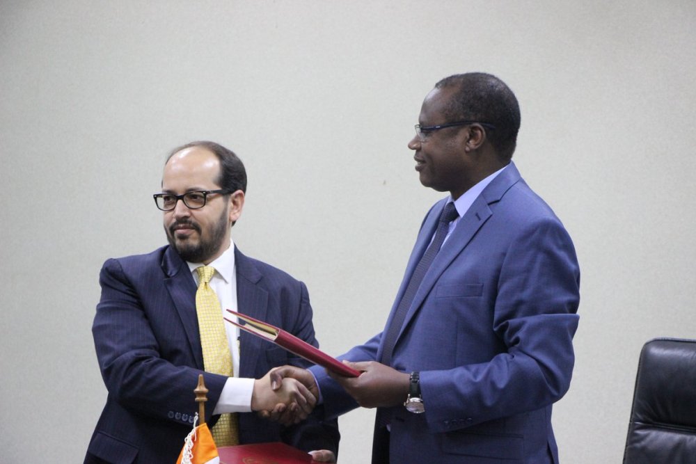 Exim Bank Regional Head, Tarun Sharma  and Minister Ndagijimana at the signing ceremony