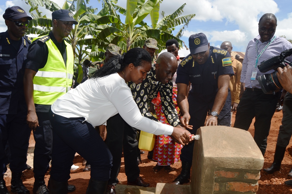 The Minister of Local Governemnt Francis Kaboneka, IGP Emmanuel K. Gasana and the Governor of Eastern Province, Judith Kazayire inaugurating clean water source in Kirehe district.