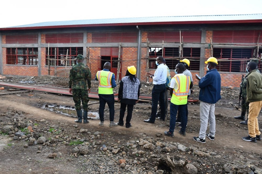 The Governor of Northern Province, Dancille Nyirarugero with other officials visiting the model village under construction.