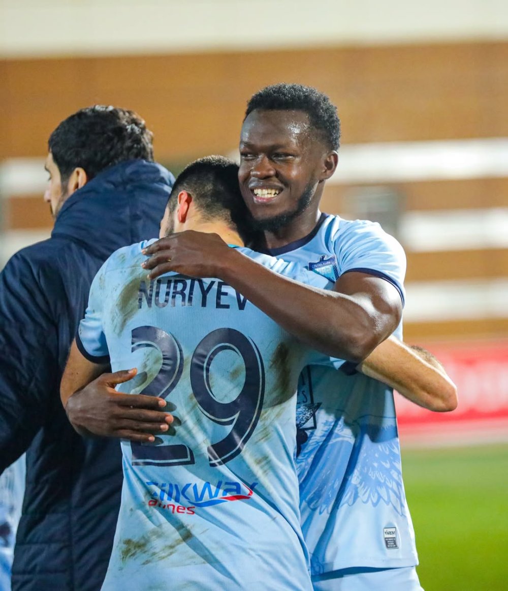 Ange Mutsinzi celebrates with a teammate after his team secured a thrilling 3-2 victory over Qarabag FK over the weekend.