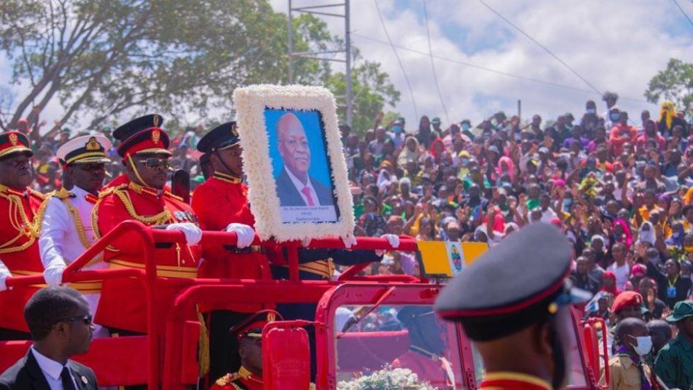 Mourners gathered in Dar es Salaam as President Magufuli's body was transported.  Photo BBC