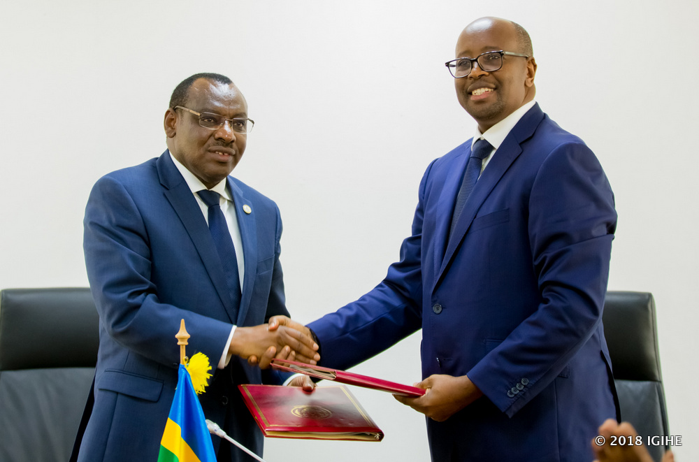Former Infrastructure Minister James Musoni handing over to incoming Minister, Amb. Claver Gatete