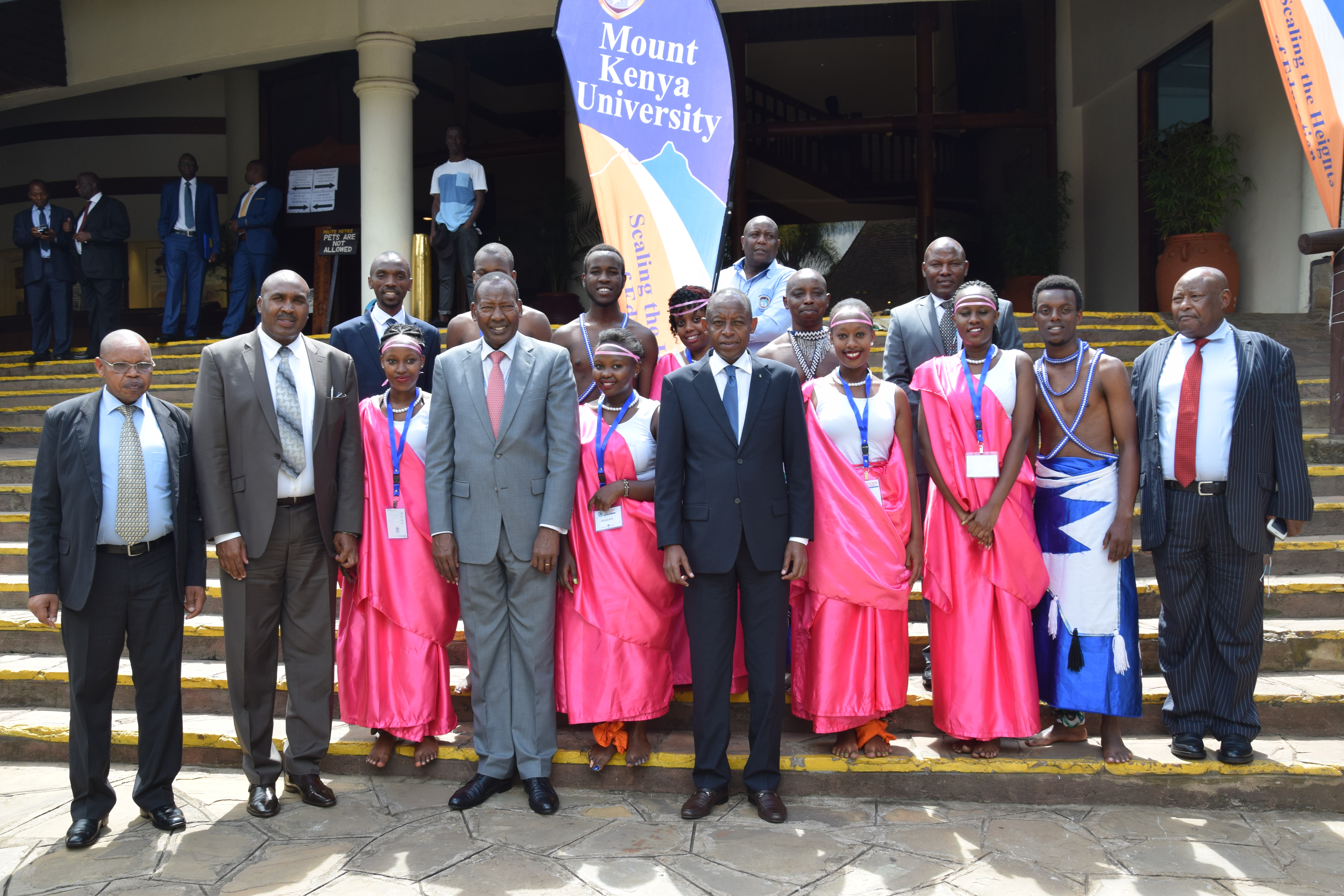 The Rwanda High Commissioner to Kenya James Kimonyo (5th left) with Mount Kenya University Rwanda Chairman and Founder Prof. Simon Gicharu, (2 nd right), Kenya cabinet secretary, Joseph Ole Nkaisery, the Chairman National Cohesion and Integration Commission, Mr. Francis Ole Kaparo (left) with members of staff from MKU and other Kenya government dignitaries pose for a group photo with Rwandan students studying in Kenya, Thika main campus, during the international Conference on Peace, Security and Social Enterprise held at Safari Park Hotel, Nairobi on Wednesday.