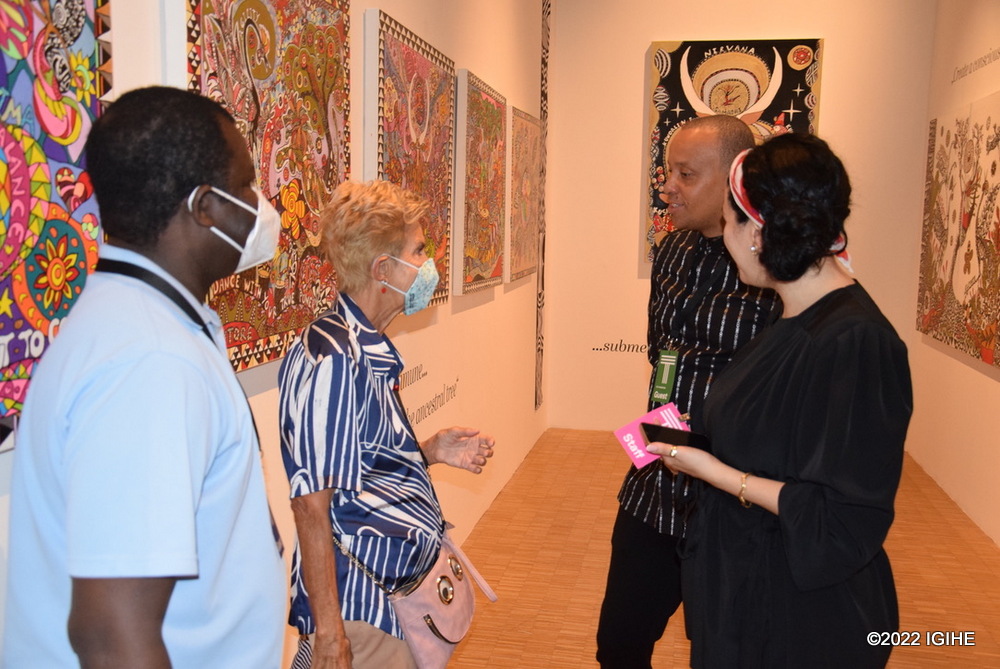 Visitors are impressed by Nukwami's paintings. 