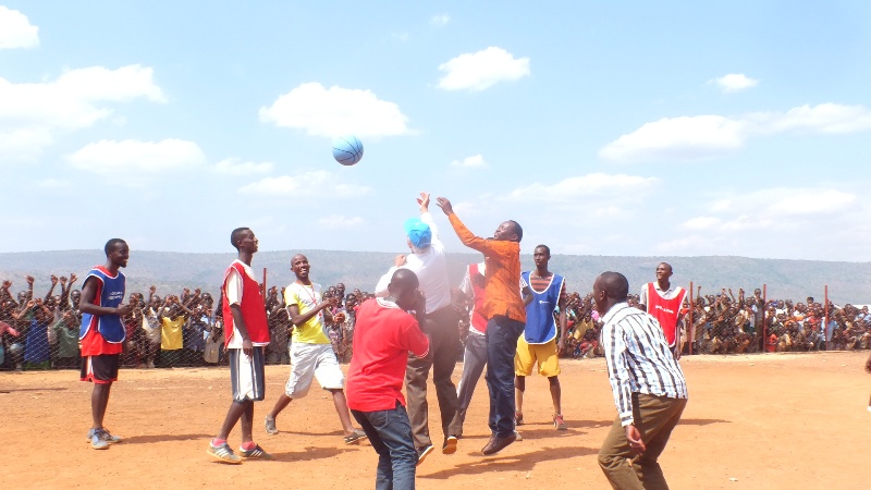 Officials from United Nations High Commissioner for Refugees playing with Burundi refugees in Mahama camp after receiving various sports materials 