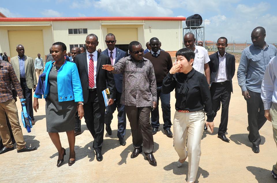 Munyeshyaka (C) and other officials tour Kigali Special Economic Zone