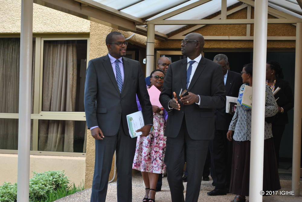 Mutangana (L) charts with Justice Minister, Johnston Busingye after exchanging ideas on prosecuting runaway genocide suspects from outside the country with the Senatorial Standing Committee on Foreign Affairs, Cooperation and Security.