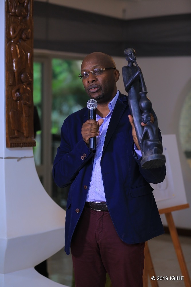 The Director General of the Institute of National Museums of Rwanda, Amb Robert Masozera holding the sculpture found in the house of former president Juvénal Habyarimana which he used to fuel divisionism leading to the execution of the 1994 Genocide against the Tutsi