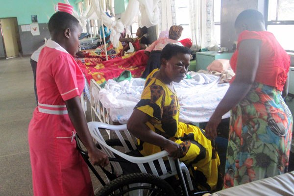 Ms Evelyn Nantumbwe (centre), one of the victims, recieves treatment at Villa Maria Hospital in Masaka District on Monday.