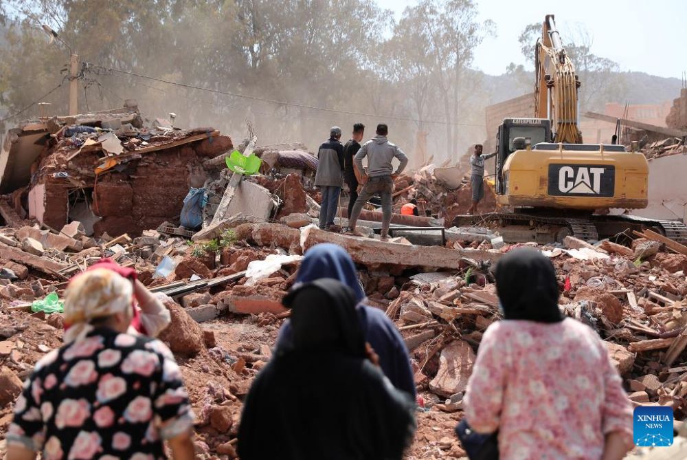 An excavator clears earthquake debris in Al Haouz Province, Morocco, Sept. 12, 2023. The death toll from the devastating earthquake in Morocco has risen to 2,901, and the injuries to 5,530, according to the latest statement released by the Moroccan government on Tuesday. (Xinhua/Wang Dongzhen)