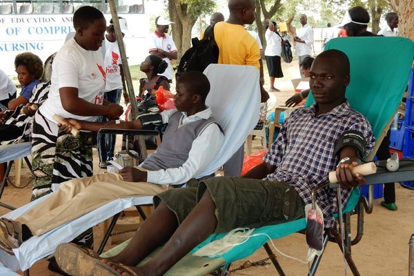 Save a life. Men donate blood during the Blood Donor Day celebrations in Arua District last year.
