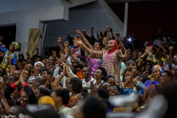 Members of the public react during the debate on term limits in Parliament.