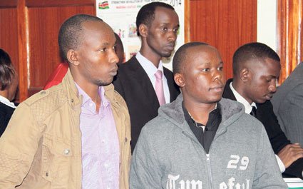 Alex Mutungi Mutuku (front right) and other suspects appear in a Nairobi court on January 14, 2015 on charges of hacking into NIC bank’s computer database. Mr Mutuku has been accused of hacking into KRA computers.