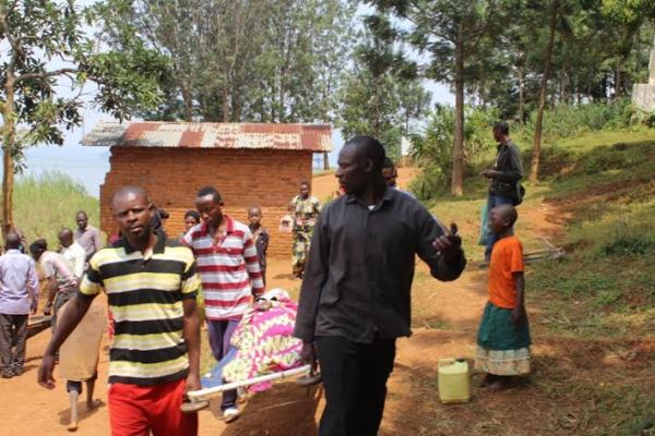 Nkombo residents carrying a patient
