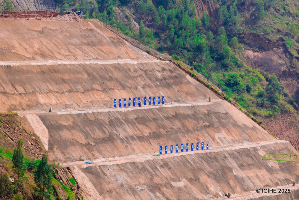 The areas above and below the dam have been reinforced to ensure stability and prevent any structural failure.