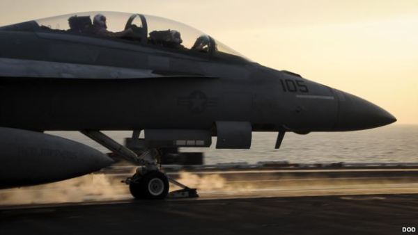 An F/A-18F Super Hornet launches from the flight deck of the aircraft carrier USS Theodore Roosevelt, which is supporting strike operations in Iraq and Syria, Oct. 10, 2015.