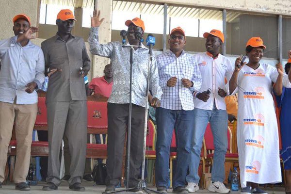 Cord leader Raila Odinga (behind microphones) flanked by Turkana Governor Josphat Nanok (second left) and other ODM lawmakers in Kalokol, Turkana Central, on August 28, 2016 when they campaigned for an ODM candidate for ward representative in a by-election scheduled for October.