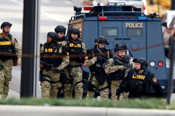 Law enforcement officials are seen outside of a parking garage on the campus of Ohio State University as they respond to an active attack in Columbus, Ohio, on November 28, 2016.