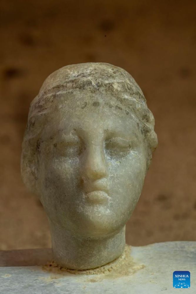 This undated photo shows a statue head uncovered at the Taposiris Magna temple complex west of Alexandria, Egypt.(Egyptian Ministry of Tourism and Antiquities/Handout via Xinhua)