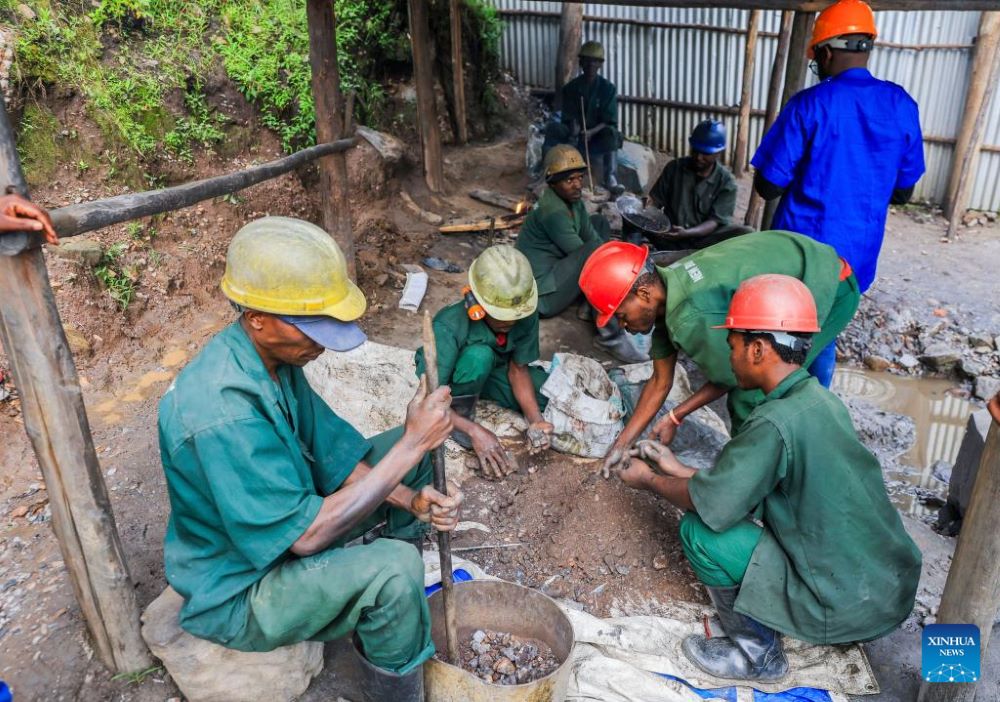 Workers sorts out extracted tungsten minerals at a mining facility in Burera District, Northern Province, Rwanda, on Nov. 28, 2023. (Photo by Cyril Ndegeya/Xinhua)