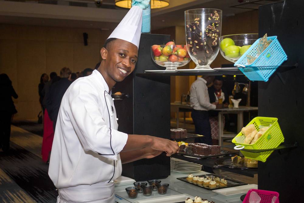 One of Kigali Marriott' Chefs preparing the dessert station