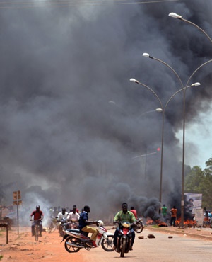 Residents burn tires along a street in Ouagadougou