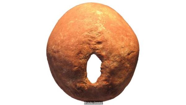 The trepanned skull of a 30-35-year-old male, one of five people in the mass grave. The hole is healed, suggesting he survived at least four years