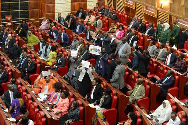 Jubilee MPs watch as their Cord counterparts protest inside the Chamber on March 31, 2016. Five of the protesters were ejected.