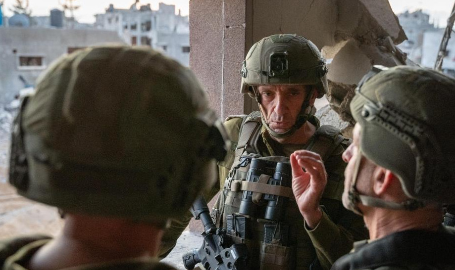 Israel's military chief Herzi Halevi (C) makes an inspection near the site where Hamas leader Yahya Sinwar was killed in the Gaza Strip, October 17, 2024.