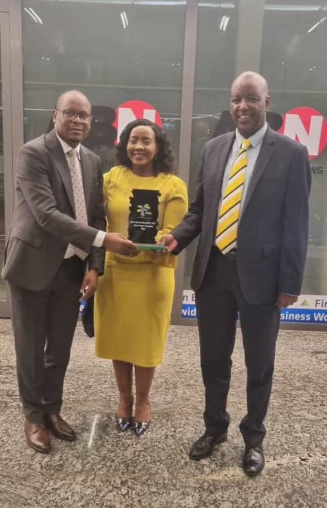 L-R: Lawrence Gakwaya, Senior Manager in Charge of Taxes at MTN; Mapula Bodibe, MTN Rwanda Chief Executive Officer and the Chief Financial Officer at MTN Rwanda after receiving the award for Best Large Taxpayer for the year 2021.  