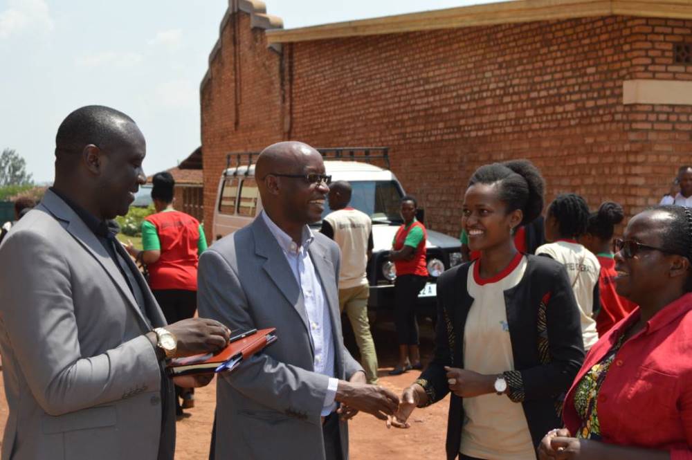 PS Ministry of Youth - Emmanuel Bigenimana, Head of Groupe Scolaire de Butare (Indatwa n'Inkesha school) -Father Celestin Rwirangira, DG of Imbuto Foundation - Sandrine Umutoni, and Social Affairs Vice Mayor of Huye District - Christine Niyomugeni share a light moment during the holiday camp.