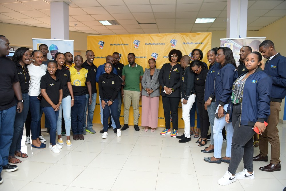 Representatives from MTN in a group photo with business owners at the launch of MoMoBiz.  