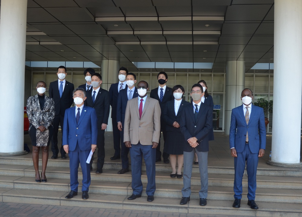 The team of Japanese volunteers in a group photo with the Minister of State for East African Community Affairs, Prof. Nshuti Manasseh.