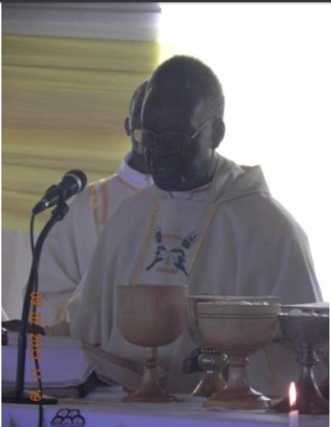 Bishop Ngirabanyiginya on the altar