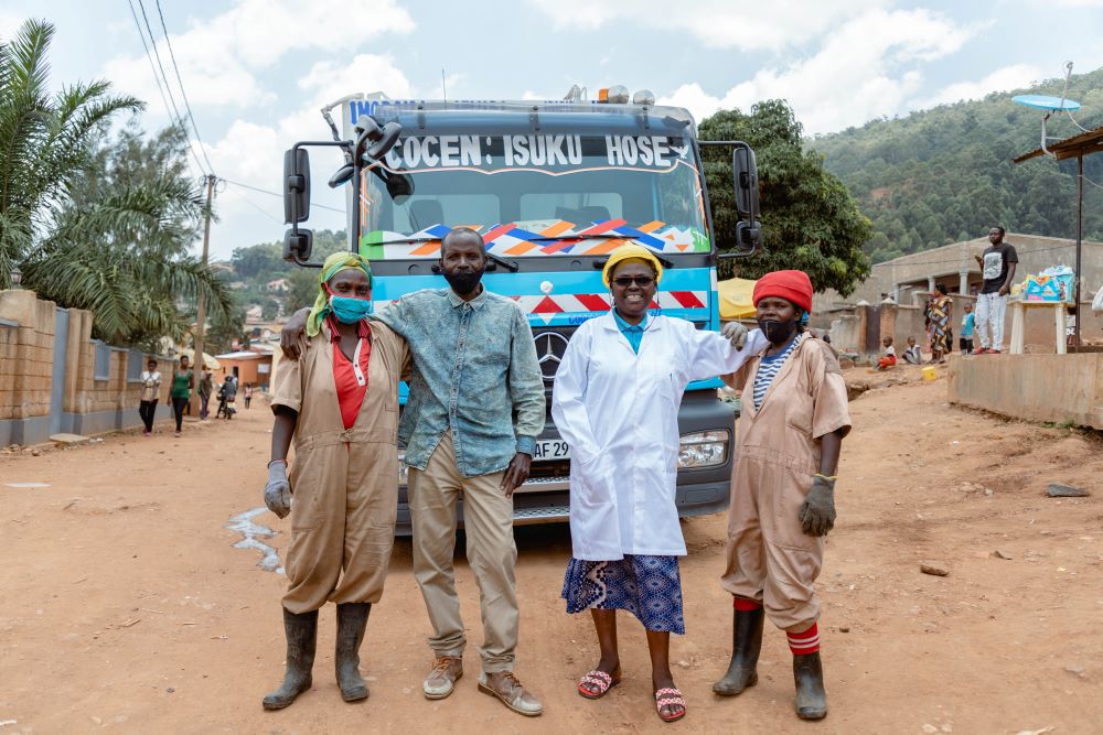 Women and man employed by COCEN, a local company that collects and transport solid waste in Kigali City.