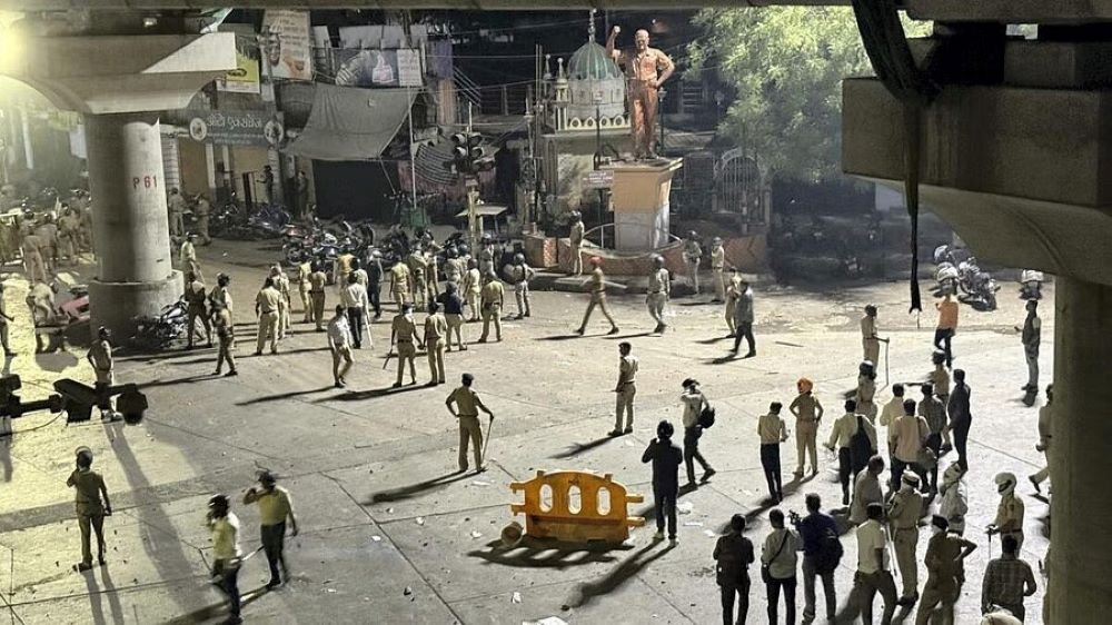 Police disperse an agitating crowd as communal tension prevailed Chitnis park area following the VHP-Bajrang Dal protest, in Nagpur.