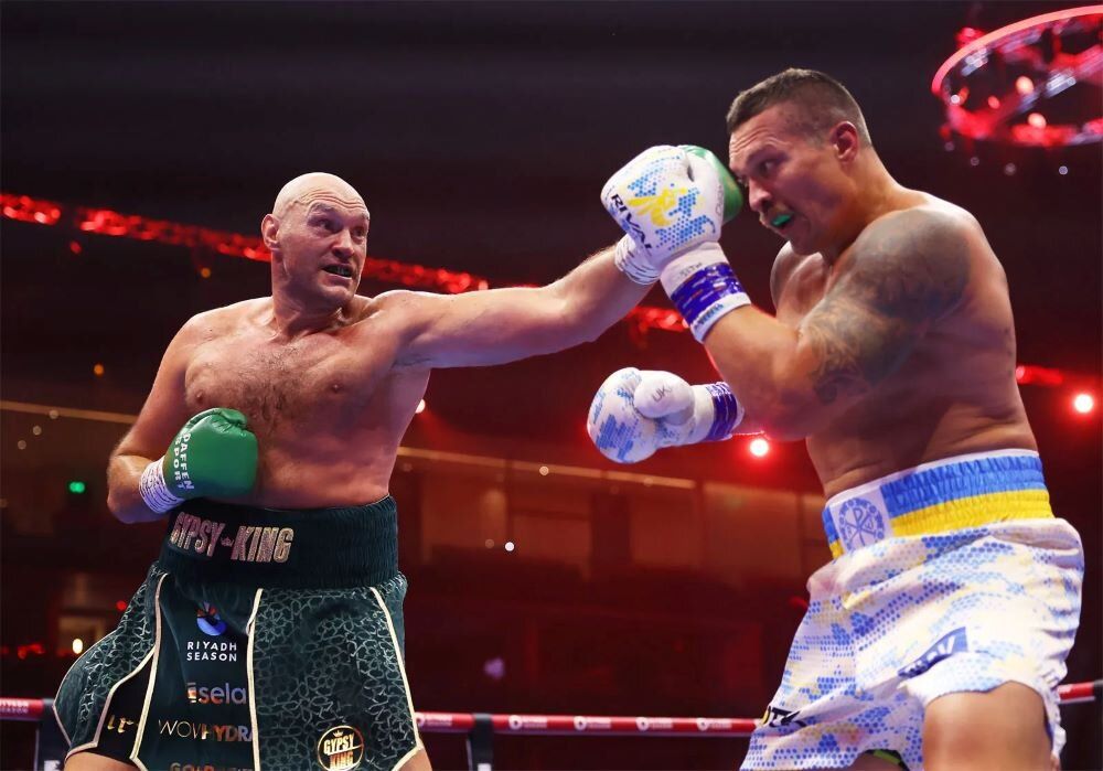 English-born boxer Tyson Fury jabbing Ukrainian fighter Oleksandr Usyk at Kingdom Arena in Riyadh, Saudi Arabia, on May 18, 2024. Fury has announced his retirement for the second time.